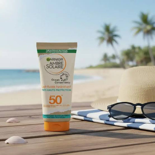 GARNIER Ambre Solaire - Lait Fluide Hydratant - Haute Protection Solaire - FPS 50 - Protège des UVA & UVB - Hydratation 24h - Résiste à L'Eau - Fini Invisible - Visage & Corps - 175 ml
